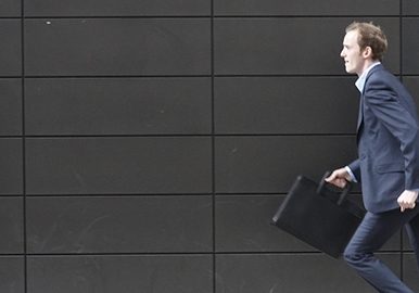 Senior couple meets with a friendly financial adviser.