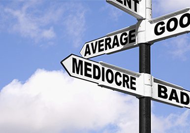 Senior couple meets with a friendly financial adviser.