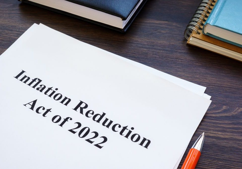 Papers with Inflation Reduction Act of 2022 and notepad.