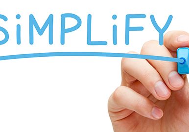Hand writing Simplify with blue marker on transparent wipe board isolated on white.